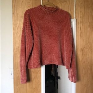 Salmon colored knit turtle neck.